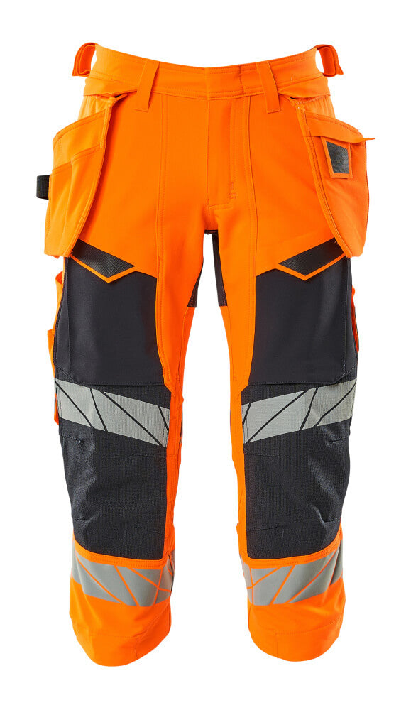 MASCOT® ACCELERATE SAFE 19049-711 – Pantalones ¾ con bolsillos colgantes - naranja de alta vis./azul marino oscuro