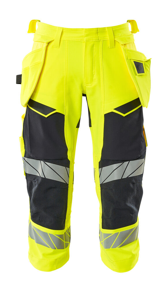 MASCOT® ACCELERATE SAFE 19049-711 – Pantalones ¾ con bolsillos colgantes - amarillo de alta vis./azul marino oscuro